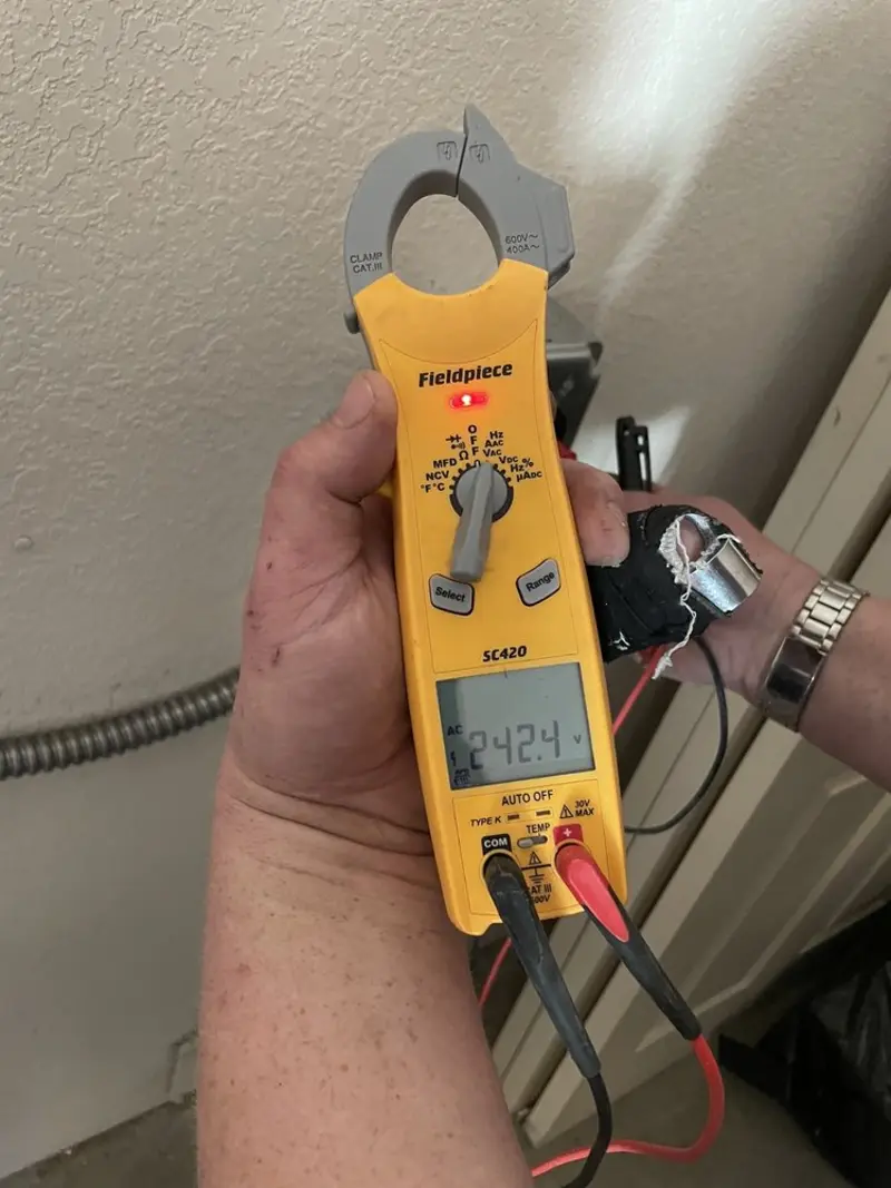 Voltage testing with clamp meter during Aluminum Wiring Replacement in Beacon